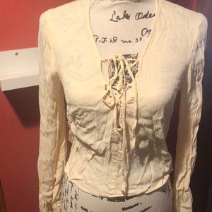 Front criss cross Yellow blouse with bell sleeves.